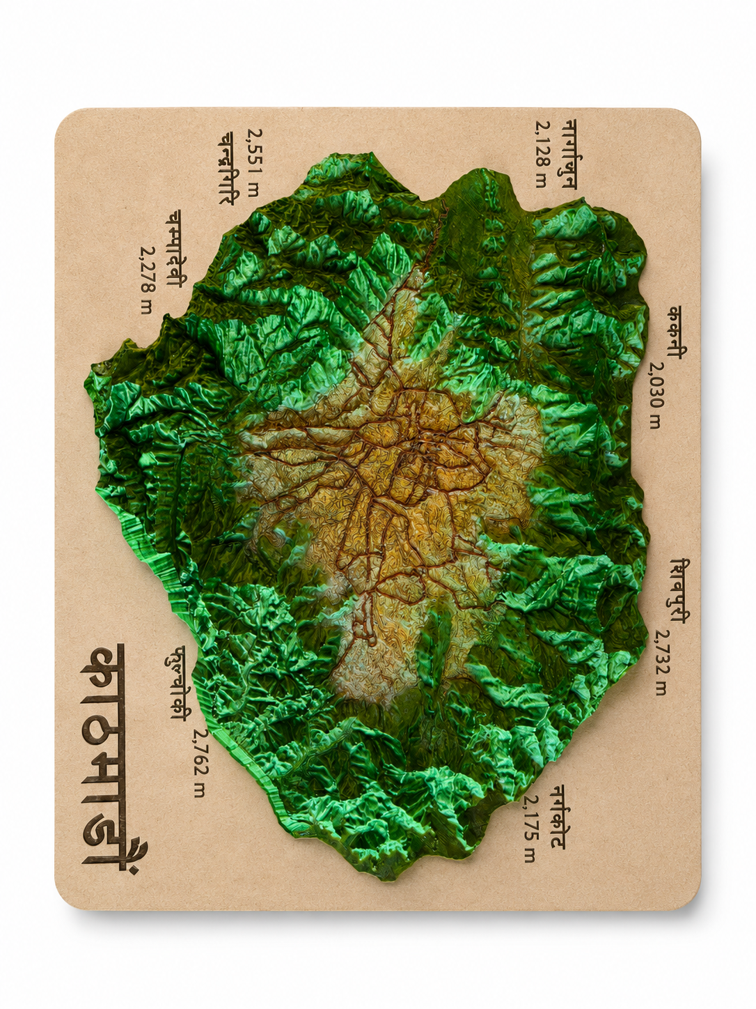 3D-printed topographic relief map of the Kathmandu Valley on a kraft board, green forested ridges raised around the ochre valley floor